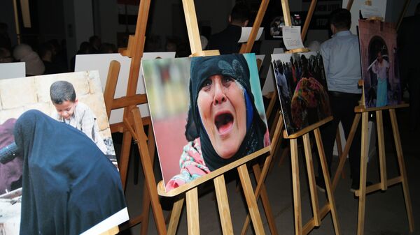 نمایشگاه عکس به مناسبت ششمین سال آغاز بمباران یمن توسط ائتلاف عربی در مسکو - اسپوتنیک ایران  