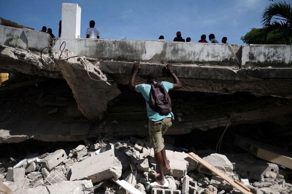 خانه‌های ویران، سرنوشت‌های به‌فنارفته
پیامدهای زلزله هائیتی - اسپوتنیک ایران  