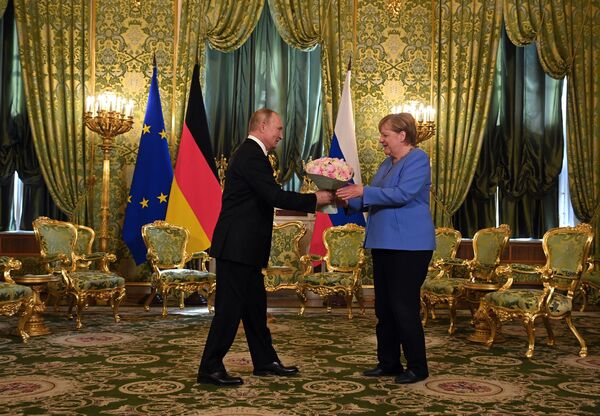 رئیس جمهور روسیه ولادیمیر پوتین و صدر اعظم آلمان آنگلا مرکل  - اسپوتنیک ایران  