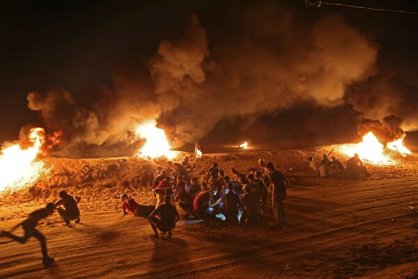 اعتراضات شبانه فلسطینی ها در مرز اسرائیل - اسپوتنیک ایران  