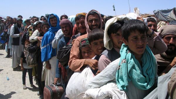 Люди на пропускном пункте «Ворота дружбы» в пакистано-афганском пограничном городе Чаман, Пакистан - اسپوتنیک ایران  