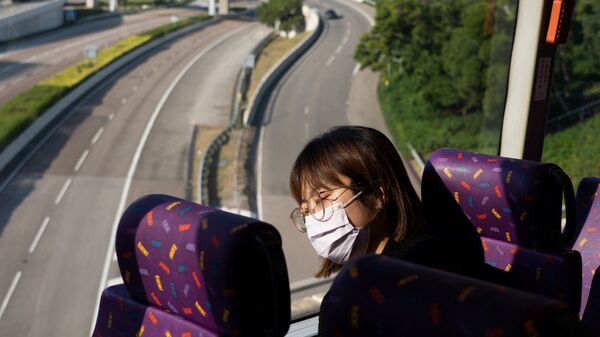 Пассажир спит в автобусе во время путешествия в никуда в Гонконге  - اسپوتنیک ایران  