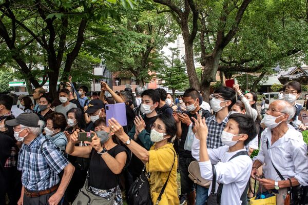 مراسم تشییع جنازه شینزو آبه، نخست‌وزیر سابق ژاپن که در جریان مبارزات انتخاباتی روز 8 جولای مورد اصابت گلوله قرار گرفت و کشته شد، در توکیو، پایتخت این کشور برگزار شد. - اسپوتنیک ایران  