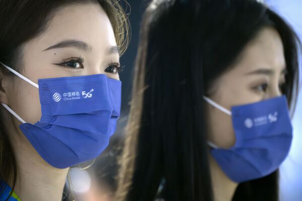 کارمندان نمایشگاه شرکت فناوری نوکیا "پی تی اکسپو"در پکن، یکشنبه، 4 ژوئن 2023. نمایشگاه سالانه محصولات شرکت های فناوری چینی و خارجی را به نمایش می گذارد. - اسپوتنیک ایران  