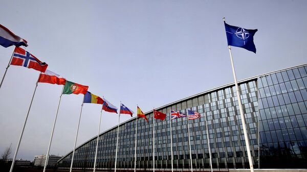 Флаги стран-членов НАТО у штаб-квартиры организации в Брюсселе  - اسپوتنیک ایران  