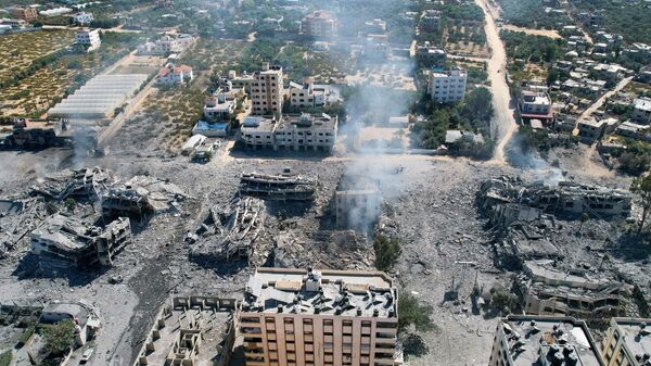 Вид с высоты птичьего полета на разрушенные здания в городе аль-Захра к югу от города Газа - اسپوتنیک ایران  