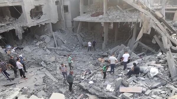پیامد ضربات اسرائیل به ساختمان مسکونی غزه - اسپوتنیک ایران  