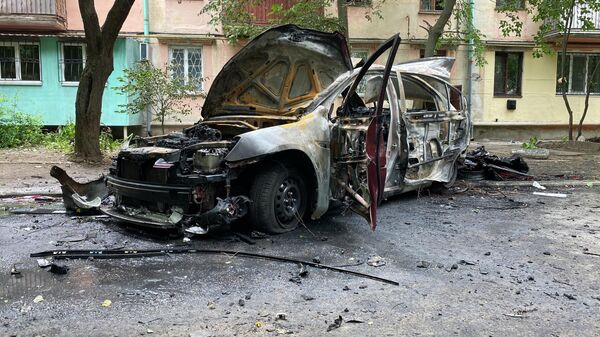 Сгоревший автомобиль на месте теракта в Херсоне - اسپوتنیک ایران  