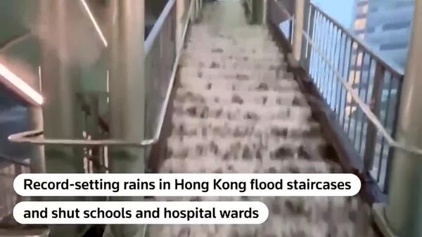 آسمان تاریک، باران سیل‌آسا را بر هنگ کنگ بارید - اسپوتنیک ایران  