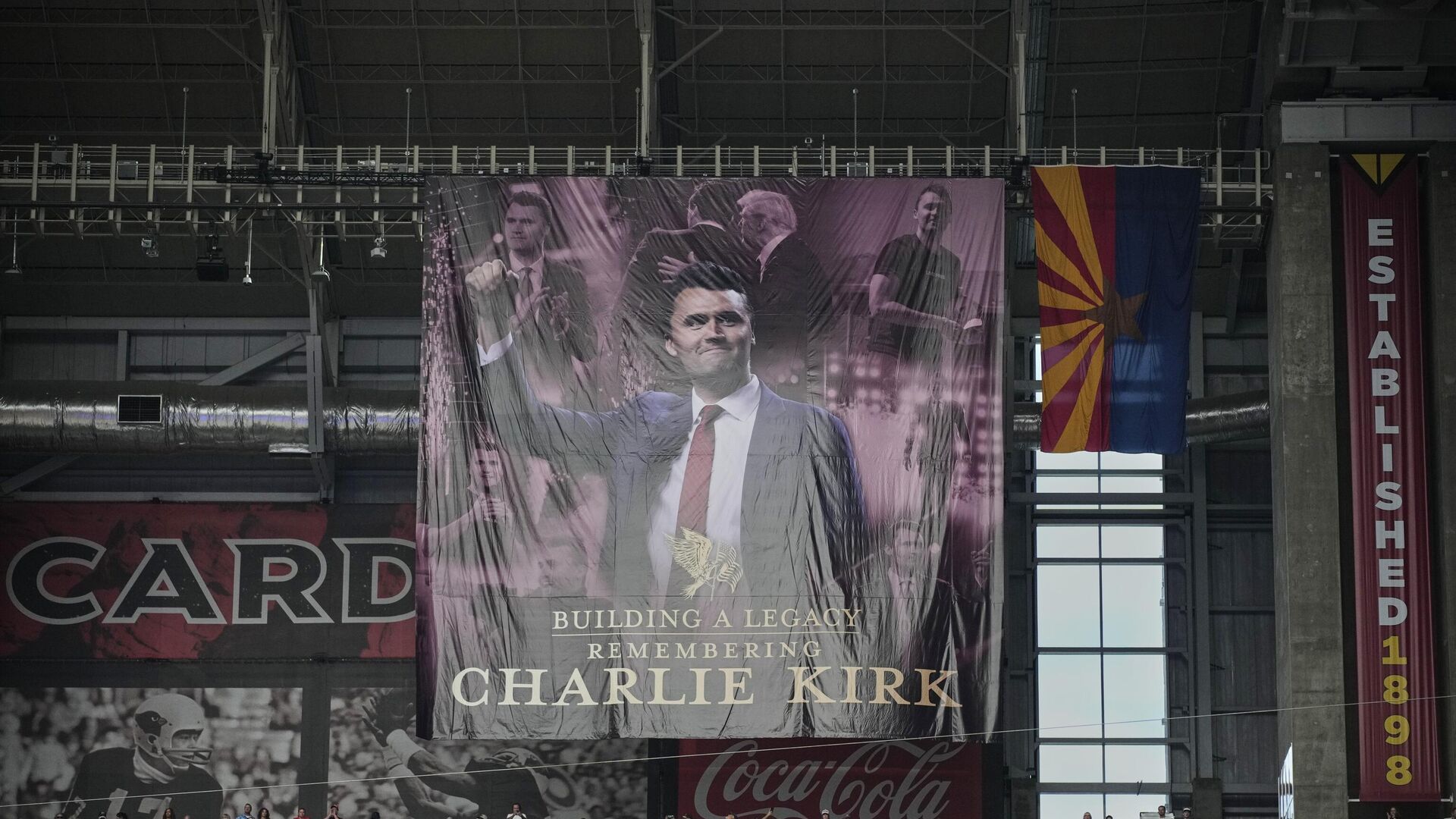 A banner for conservative activist Charlie Kirk is seen during a memorial service for Kirk A banner for conservative activist Charlie Kirk is seen during a memorial service for Kirk - اسپوتنیک ایران , 1920, 21.09.2025