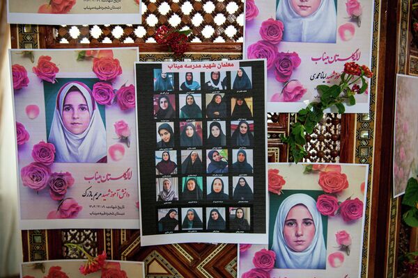Portraits of school children from the Shajarah Tayyebeh Elementary School in Minab, who were killed in a U.S strike are displayed during a press conference by Iranian Ambassador to Tunisia Massoud Hosseinian, in Tunis, Tunisia, Thursday, March 12, 2026. (AP Photo/Ons Abid) - اسپوتنیک ایران  