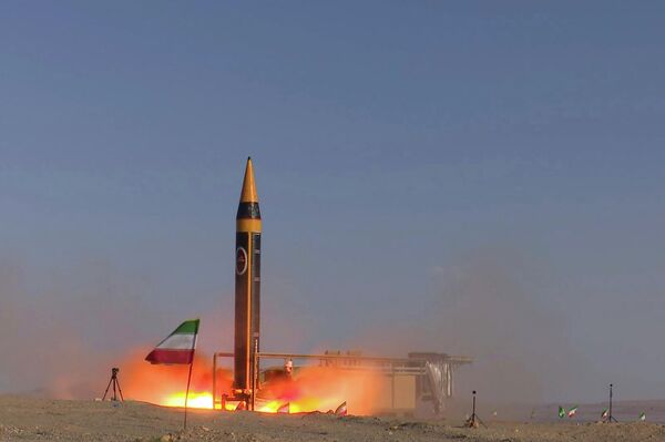 In this photo released by the Iranian Defense Ministry on May 25, 2023, Khorramshahr-4 missile is launched at an undisclosed location, Iran (Iranian Defense Ministry via AP) - اسپوتنیک ایران  