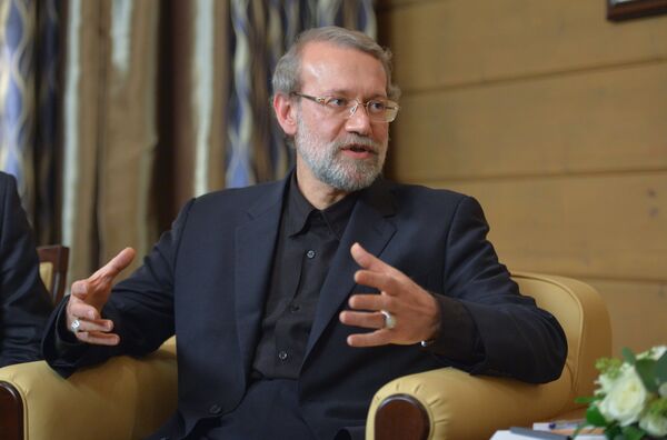 Speaker of the Islamic Consultative Council (parliament) of the Islamic Republic of Iran Ali Larijani during a meeting with Russian President Vladimir Putin following the 12th annual meeting of the Valdai International Discussion Club. File photo - اسپوتنیک ایران  