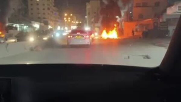 درگیری‌ها بین فلسطینی‌ها و نیروهای اسرائیلی در نزدیکی ایست بازرسی نظامی قلندیا در شمال بیت المقدس - اسپوتنیک ایران  