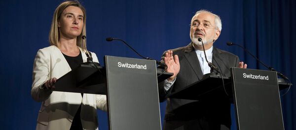 Iranian Foreign Minister Javad Zarif (R) delivers a statement, flanked by European Union High Representative for Foreign Affairs and Security Policy Federica Mogherini, at the Swiss Federal Institute of Technology in Lausanne on April 2, 2015 Iranian Foreign Minister Javad Zarif (R) delivers a statement, flanked by European Union High Representative for Foreign Affairs and Security Policy Federica Mogherini, at the Swiss Federal Institute of Technology in Lausanne on April 2, 2015 - اسپوتنیک ایران