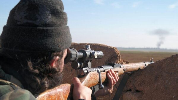 A militant fighter aims a sniper rifle during during fighting in Tal Tamr, Hassakeh province, Syria - اسپوتنیک ایران  