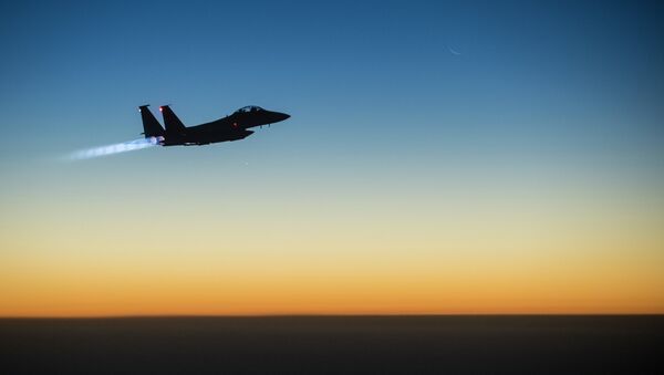 A US Air Force F-15E Strike Eagle aircraft flies over northern Iraq Sept. 23, 2014 - اسپوتنیک ایران  