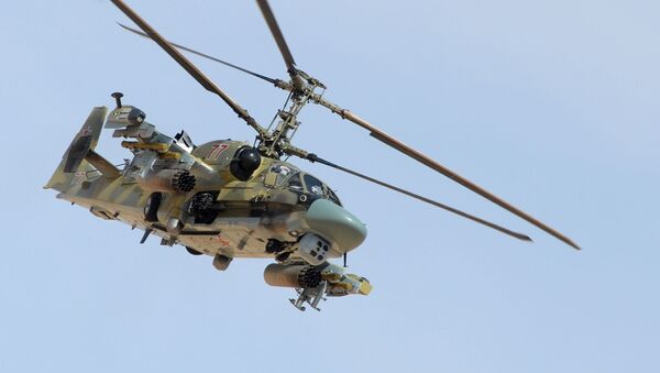 Вертолет Ка-52 Аллигатор во время боевой операции в окрестностях освобожденного от боевиков города Эль-Карьятейн - اسپوتنیک ایران  