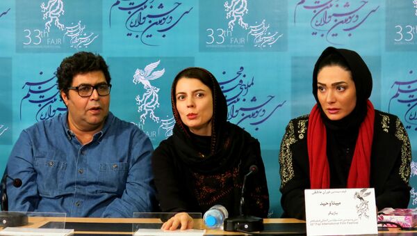 Иранские актеры Farhad Aslani, Leila Hatami и Mina Vahid на 33ем кинофестивале Фаджр в Тегеране - اسپوتنیک ایران  