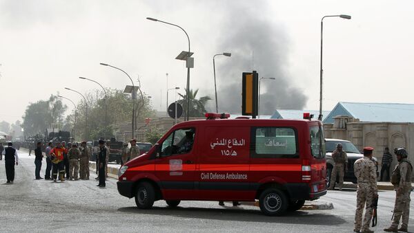 An ambulance arrives at the scene of a bomb attack in Baghdad. File photo - اسپوتنیک ایران  