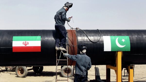 FILE - In this March 11, 2013 file photo, Iranian workers weld two gas pipes together at the start of construction on a pipeline to transfer natural gas from Iran to Pakistan, in Chabahar, southeastern Iran, near the Pakistani border - اسپوتنیک ایران  