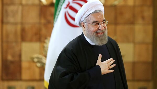Iran's President Hassan Rouhani gestures at the conclusion of his press conference, in Tehran, Iran, Sunday, Jan. 17, 2016. The implementation of a historic nuclear deal with world powers is expected to pave the way for a new economic reality in Iran, now freed from harsh international sanctions - اسپوتنیک ایران  