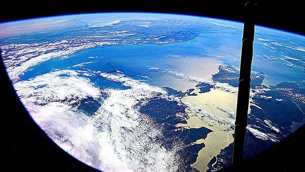 Земля, сфотографированная космонавтом Юрием Маленченко - اسپوتنیک ایران  