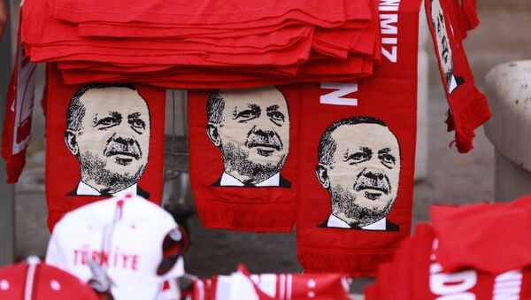 This picture taken on July 25, 2016, shows scarves with the effigy of Turkish President Recep Tayyip Erdogan a rally against the military coup in Ankara - اسپوتنیک ایران  