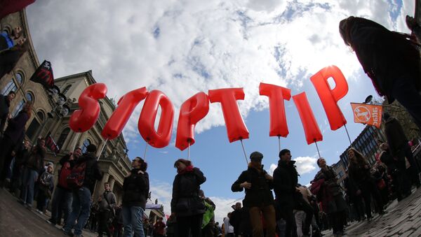 In this photo taken with a fisheye-lens demonstrators hold giant letters during a demonstration against the controversial transatlantic trade agreement TTIP in Hanover, Germany, Saturday, April 23, 2016. - اسپوتنیک ایران  