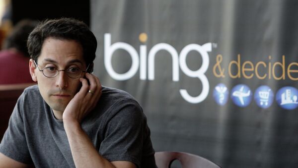 Microsoft employee Joshua Schnoll sits near a sign promoting Bing, Microsoft's recently upgraded search engine, in a company cafeteria in Redmond, Wash - اسپوتنیک ایران  
