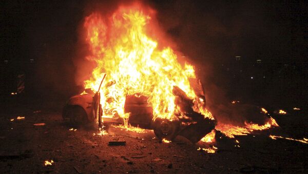 Горящий автомобиль после взрыва в Анкаре - اسپوتنیک ایران  