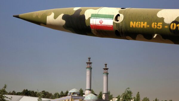 A missile is displayed at an exhibition on the 1980-88 Iran-Iraq war, at a park, northern Tehran, Iran, Thursday, Sept. 25, 2014 - اسپوتنیک ایران  