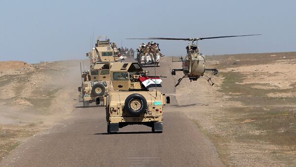 In this Wednesday, March 9, 2016 photo, Iraqi Defense Minister Khaled al-Obeidi's convoy tours the front line in their fight against Islamic State group militants in the Samarra desert, on the border between Anbar and Salahuddin provinces, Iraq - اسپوتنیک ایران  
