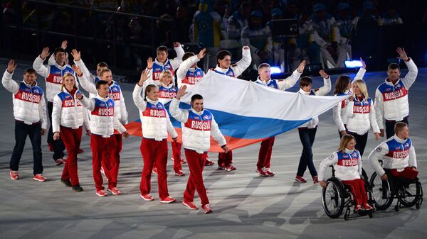 Вынос национального флага России на церемонии закрытия XI зимних Паралимпийских игр в Сочи - اسپوتنیک ایران  