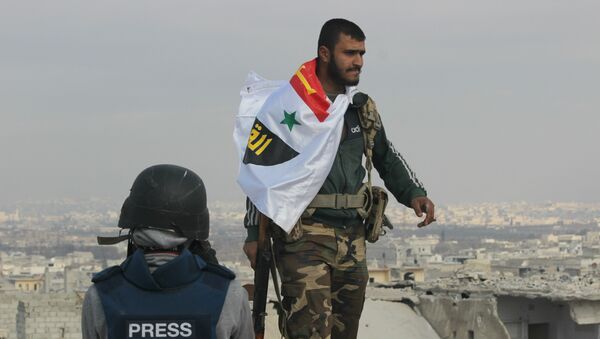 Picture of Syrian Arab Army soldier on rooftop of Sheikh Saeed in Eastern Aleppo the morning after full liberation from Nusra Front led militant factions. - اسپوتنیک ایران  