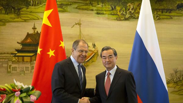 Министр иностранных дел России Сергей Лавров и глава МИД Китая Ван И на встрече в Пекине - اسپوتنیک ایران  