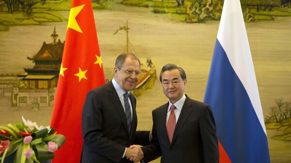 Министр иностранных дел России Сергей Лавров и глава МИД Китая Ван И на встрече в Пекине - اسپوتنیک ایران  