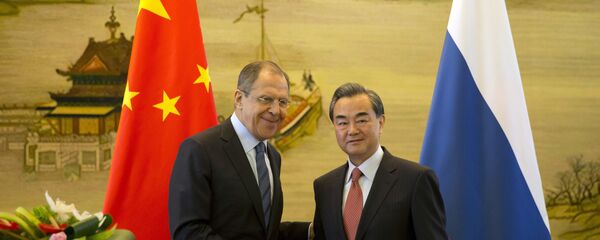 Министр иностранных дел России Сергей Лавров и глава МИД Китая Ван И на встрече в Пекине Министр иностранных дел России Сергей Лавров и глава МИД Китая Ван И на встрече в Пекине - اسپوتنیک ایران