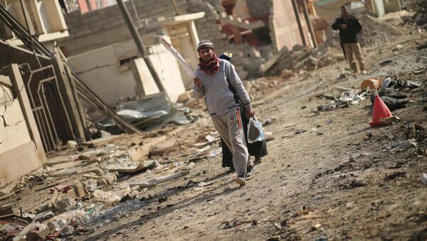 کشف اجساد 112 نفر در یکی از مناطق بمباران شده در موصل - اسپوتنیک ایران  
