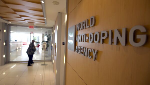 A woman walks into the head office of the World Anti-Doping Agency (WADA) in Montreal, Quebec, Canada November 9, 2015 - اسپوتنیک ایران  