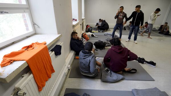 Iraqi migrants are pictured inside a refugee center located in former barracks, in Lahti, Finland - اسپوتنیک ایران  