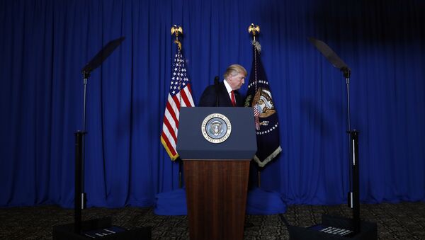 President Donald Trump walks from the podium after speaking at Mar-a-Lago in Palm Beach, Fla., Thursday, April 6, 2017, after the U.S. fired a barrage of cruise missiles into Syria Thursday night in retaliation for this week's gruesome chemical weapons attack against civilians. - اسپوتنیک ایران  
