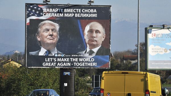 Cars pass by a billboard showing US President-elect Donald Trump and Russian President Vladimir Putin placed by pro-Serbian movement in the town of Danilovgrad on November 16, 2016 - اسپوتنیک ایران  