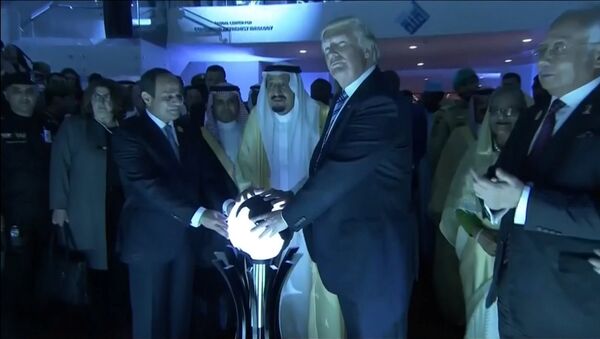 U.S. President Donald Trump places his hands on a glowing orb as he tours with other leaders the Global Center for Combatting Extremist Ideology in Riyadh, Saudi Arabia May 21, 2017 - اسپوتنیک ایران  