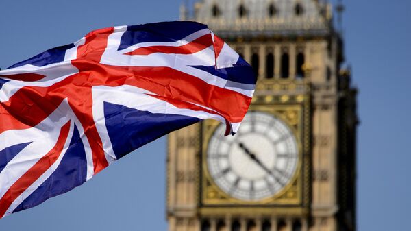 Британский флаг на фоне Биг-Бена в Лондоне // AFP / Fabrice Coffrini - اسپوتنیک ایران  