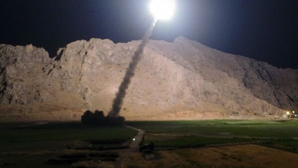 In this picture released by the Iranian state-run IRIB News Agency on Monday, June 19, 2017, a missile is fired from city of Kermanshah in western Iran targeting the Islamic State group in Syria - اسپوتنیک ایران  