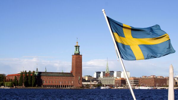 Шведский флаг на фоне Стокгольмской ратуши - اسپوتنیک ایران  