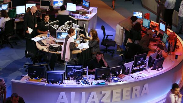 A general view shows the newsroom at the headquarters of the Qatar-based Al-Jazeera satellite channel in Doha  - اسپوتنیک ایران  