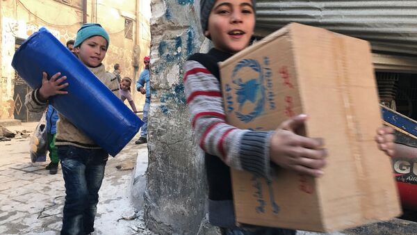 بازگشت انبوه مردم به شهر حلب سوریه پس از آزادی این شهر از شبه نظامیان - اسپوتنیک ایران  