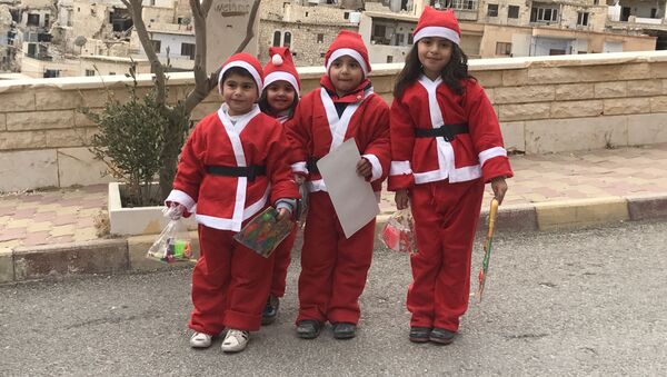 ساکنین شهر معلولا در کلسیای فکل مقدس ، کریسمس را جشن می گیرند - اسپوتنیک ایران  